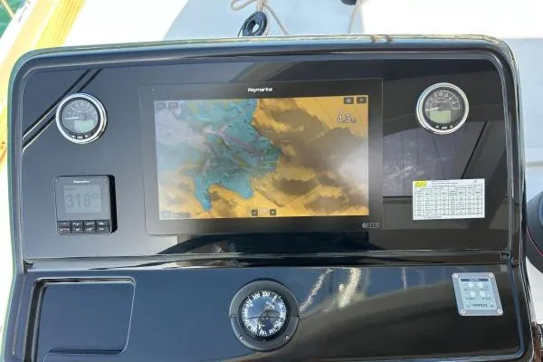 Maty Yacht Photos Pics Control panel of 2023 Lagoon Seventy 7 yacht with navigation display and compass.