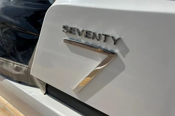 Maty Yacht Photos Pics 2023 Lagoon Seventy 7 yacht emblem on sleek white surface.