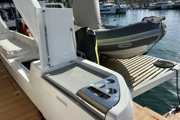 Maty Yacht Photos Pics 2023 Lagoon Seventy 7 yacht with outdoor kitchen and tender on deck.