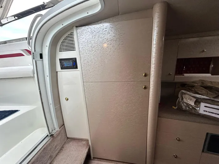 Current Asset Yacht Photos Pics Interior of a 2001 Formula 400 Super Sport boat, featuring cabinetry and storage space.