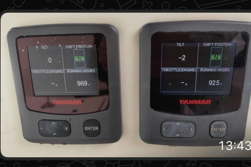  Yacht Photos Pics Digital displays on a 2018 Vanquish Yachts VQ 45 showing engine data and running hours.