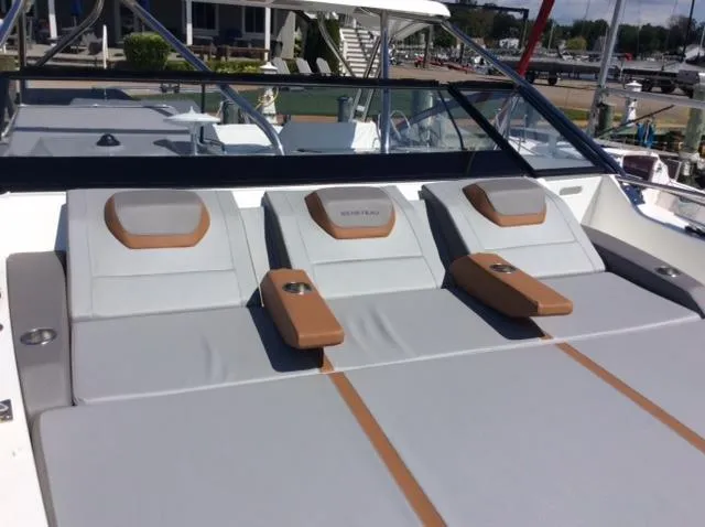  Yacht Photos Pics 2023 Beneteau Flyer 10 boat with luxurious sunbathing deck and comfortable seating.