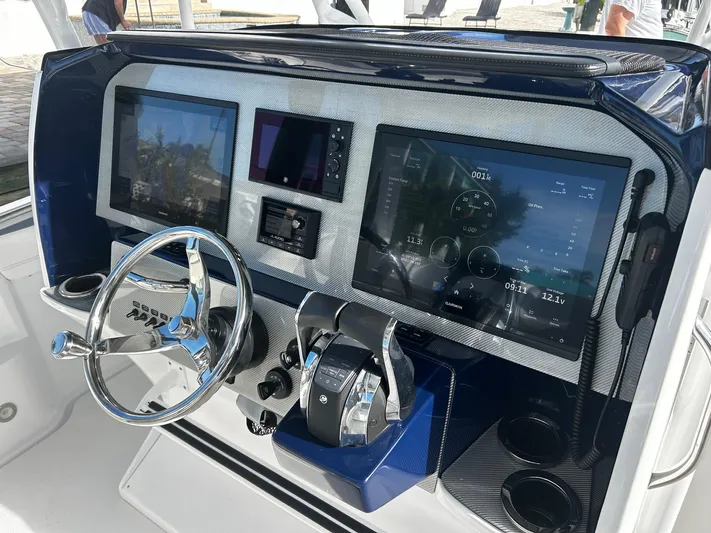  Yacht Photos Pics 2021 Nor-Tech 390 Sport Center Console helm with advanced navigation displays and controls.