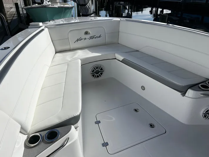  Yacht Photos Pics 2021 Nor-Tech 390 Sport Center Console boat with white seating and storage compartments.