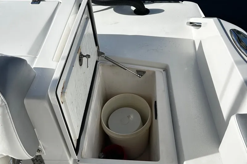  Yacht Photos Pics Open storage compartment on a 2021 Nor-Tech 390 Sport Center Console boat.