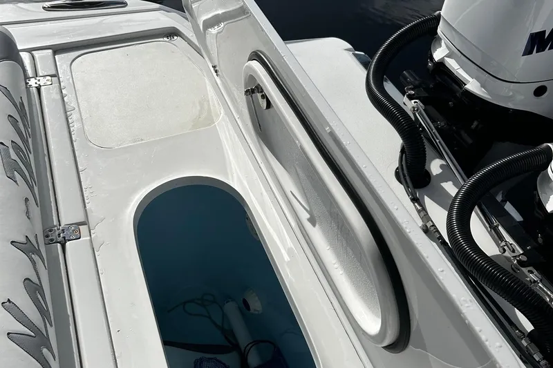  Yacht Photos Pics 2021 Nor-Tech 390 Sport Center Console boat interior with storage compartments and Mercury engine.
