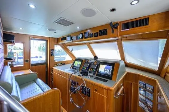 Pomboo Yacht Photos Pics Interior of 1998 Hatteras 70 Cockpit Motor Yacht with modern navigation equipment.