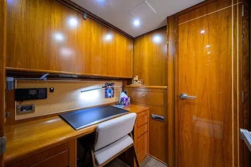 Pomboo Yacht Photos Pics Luxurious wooden interior of 1998 Hatteras 70 Cockpit Motor Yacht office space.
