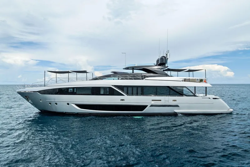 Riva Royale Yacht Photos Pics Luxurious 2023 Riva 110' Dolcevita yacht on open sea under clear sky.