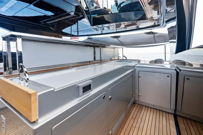 Riva Royale Yacht Photos Pics Luxurious outdoor kitchen on 2023 Riva 110' Dolcevita yacht with sleek cabinetry and modern design.