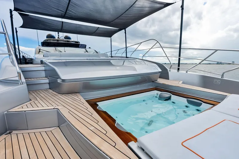 Riva Royale Yacht Photos Pics Luxurious 2023 Riva 110' Dolcevita yacht deck with jacuzzi and sleek design.