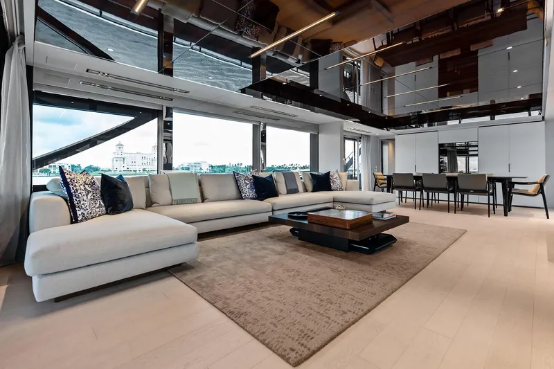 Riva Royale Yacht Photos Pics Luxurious interior of 2023 Riva 110' Dolcevita yacht with modern furnishings and panoramic windows.