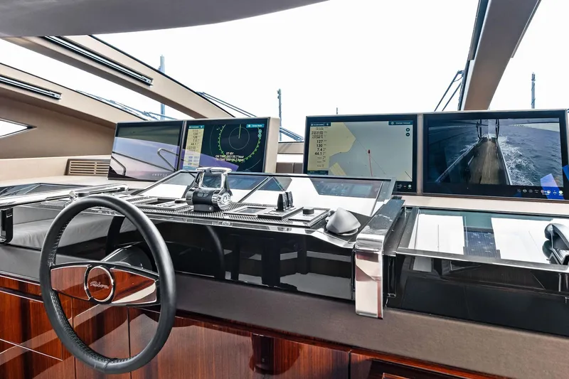 Riva Royale Yacht Photos Pics Cockpit of 2023 Riva 110' Dolcevita yacht with advanced navigation screens and controls.