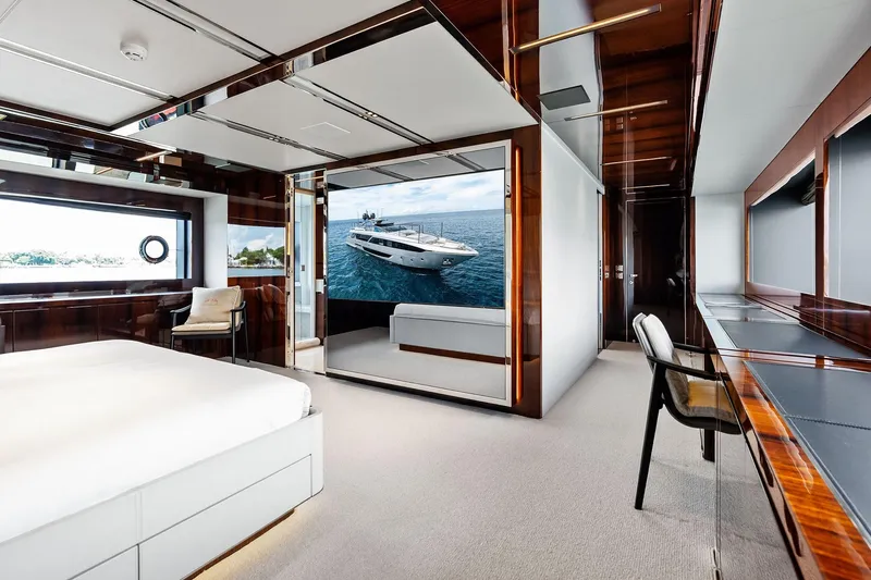 Riva Royale Yacht Photos Pics Luxurious interior of 2023 Riva 110' Dolcevita yacht with elegant furnishings and ocean view.
