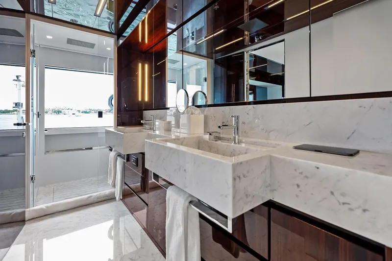 Riva Royale Yacht Photos Pics Luxurious bathroom on 2023 Riva 110' Dolcevita yacht with marble sink and modern fixtures.