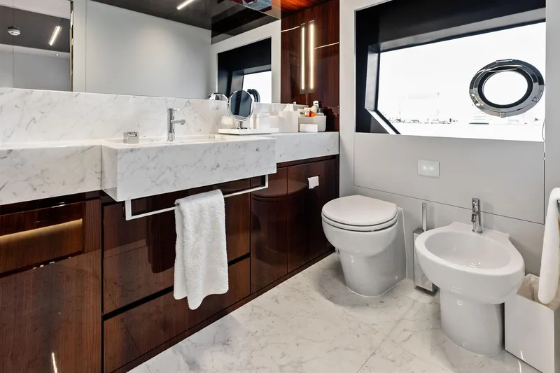 Riva Royale Yacht Photos Pics Luxurious bathroom on 2023 Riva 110' Dolcevita yacht with marble sink and modern fixtures.