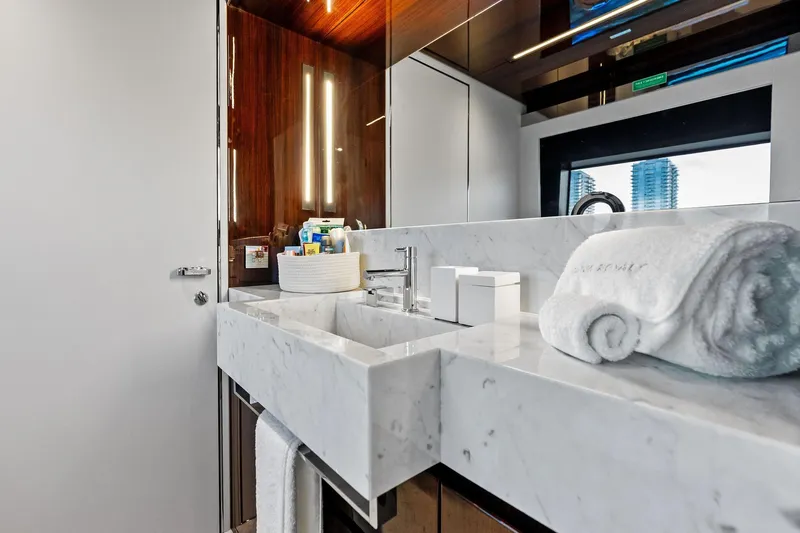 Riva Royale Yacht Photos Pics Luxurious bathroom on 2023 Riva 110' Dolcevita yacht with marble sink and elegant decor.