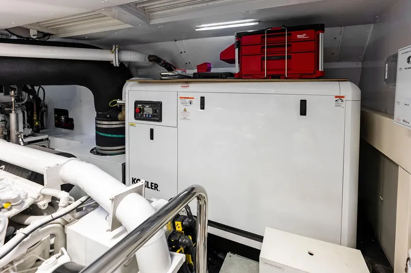 Riva Royale Yacht Photos Pics Engine room of 2023 Riva 110' Dolcevita yacht with Kohler generator and red toolbox.