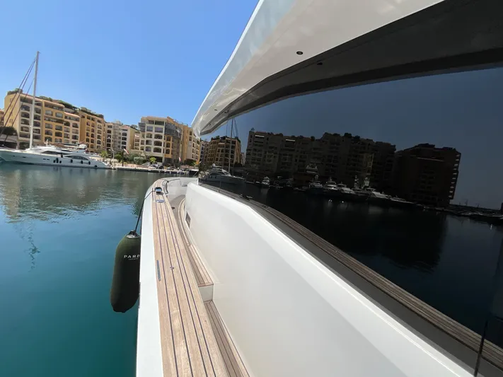  Yacht Photos Pics Pardo Yachts 60 E (2020) docked in a marina with waterfront buildings.