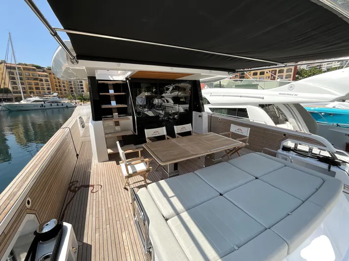  Yacht Photos Pics Luxurious 2020 Pardo Yachts 60 E with spacious deck and seating area in marina.