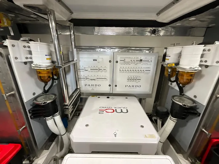  Yacht Photos Pics Engine room of 2020 Pardo Yachts 60 E, featuring dual control panels and filtration systems.