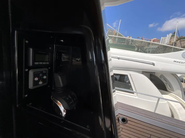  Yacht Photos Pics Control panel of 2020 Pardo Yachts 60 E with exterior view of docked yacht.