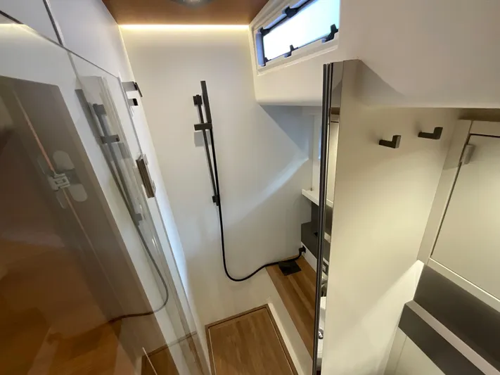  Yacht Photos Pics Modern bathroom interior of 2020 Pardo Yachts 60 E with sleek design and wooden accents.