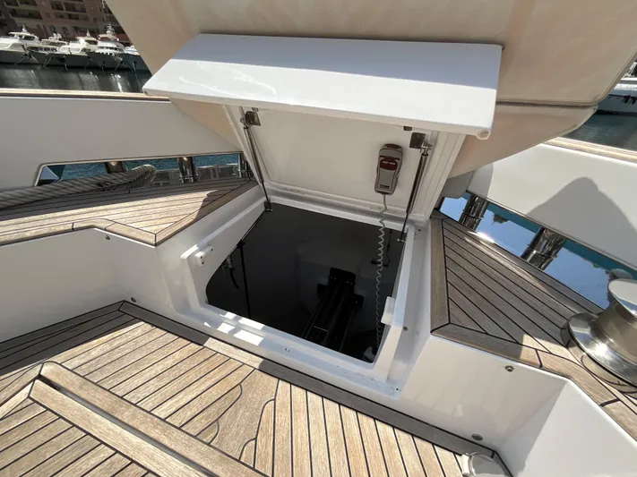  Yacht Photos Pics Hatch opening on 2020 Pardo Yachts 60 E, showcasing teak deck and marina view.