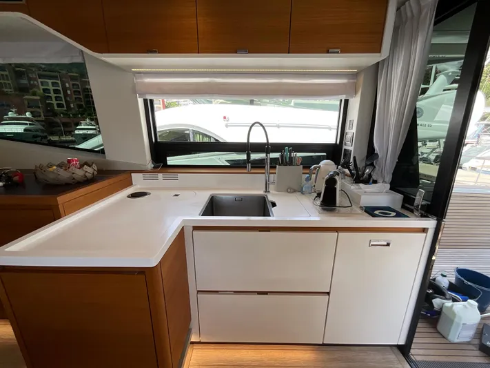  Yacht Photos Pics Modern kitchen interior on 2020 Pardo Yachts 60 E, featuring sleek cabinetry and appliances.