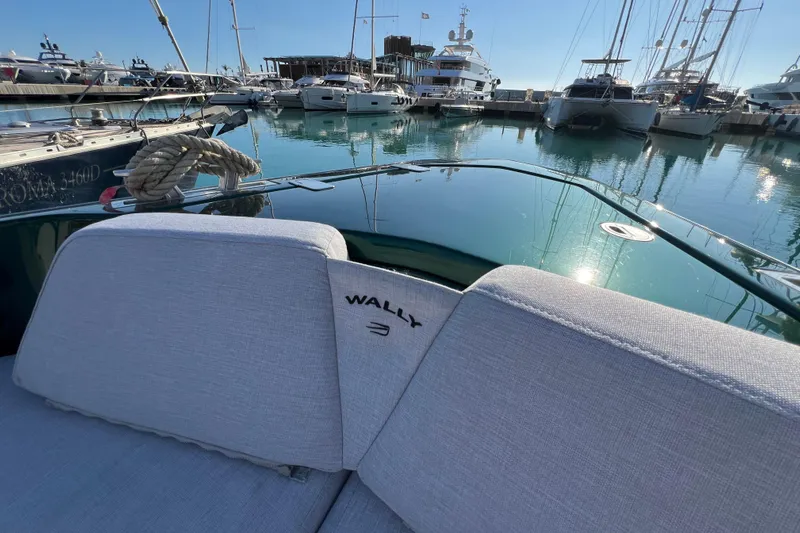  Yacht Photos Pics 2024 Wally Tender 43 X yacht docked in a marina, showcasing luxury seating.
