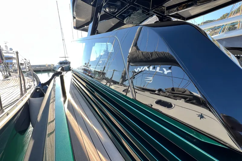  Yacht Photos Pics 2024 Wally Tender 43 X yacht with sleek design and reflective surfaces at a marina.
