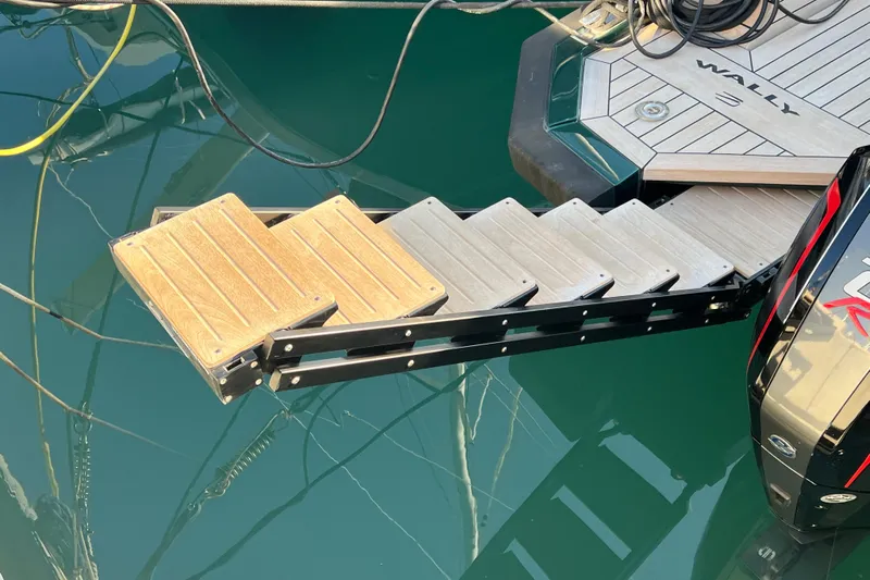  Yacht Photos Pics Boarding steps on a 2024 Wally Tender 43 X yacht, docked at a marina.