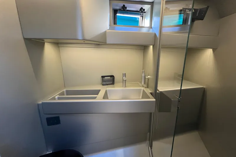  Yacht Photos Pics Modern bathroom interior of 2024 Wally Tender 43 X yacht, featuring sleek design and dual sinks.