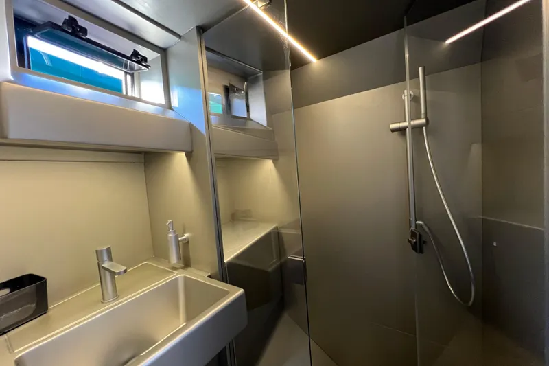  Yacht Photos Pics Modern bathroom interior of 2024 Wally Tender 43 X yacht, featuring sleek fixtures and shower.