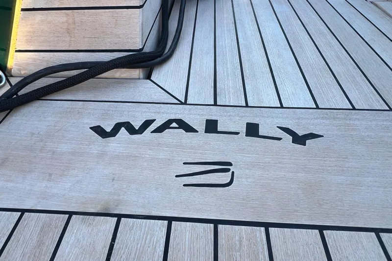  Yacht Photos Pics 2024 Wally Tender 43 X yacht deck with logo and sleek wood finish.