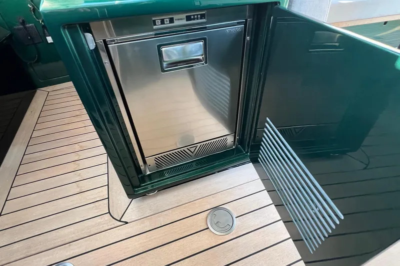  Yacht Photos Pics Stainless steel fridge on Wally Tender 43 X, 2024 model, with teak flooring.