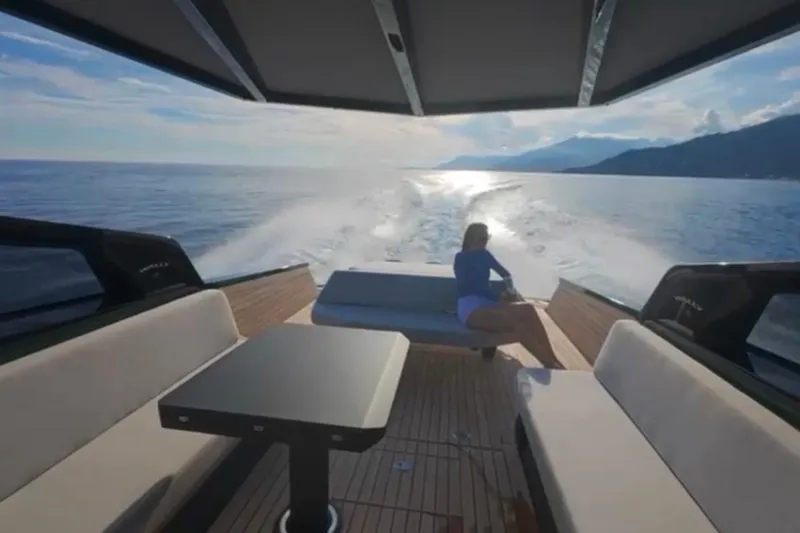  Yacht Photos Pics 2024 Wally Tender 43 X cruising on open water, featuring luxurious seating and scenic views.