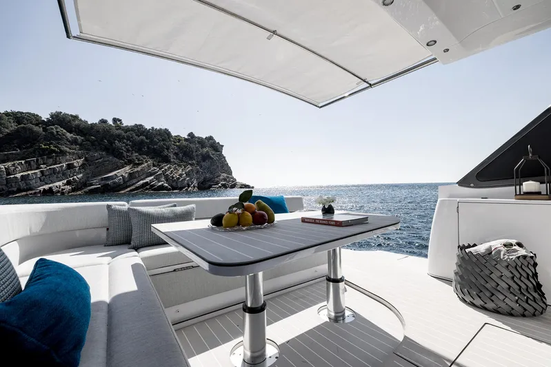  Yacht Photos Pics Luxurious Azimut Verve 42 yacht interior with ocean view, featuring elegant seating and table setup.