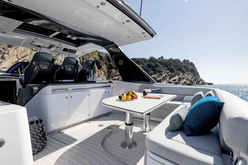  Yacht Photos Pics Luxurious 2025 Azimut Verve 42 yacht interior with seating, table, and ocean view.