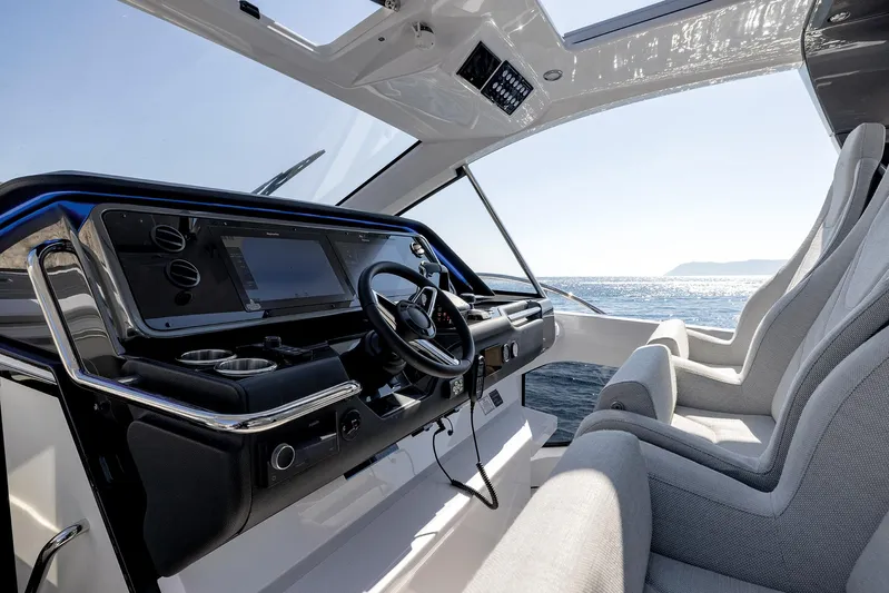  Yacht Photos Pics 2025 Azimut Verve 42 yacht cockpit with modern steering and ocean view.