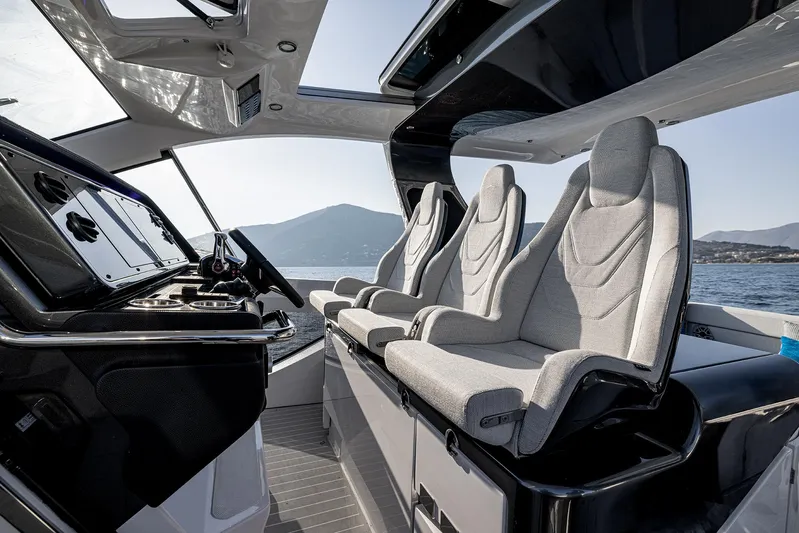  Yacht Photos Pics Interior of 2025 Azimut Verve 42 yacht with modern seating and sleek dashboard.