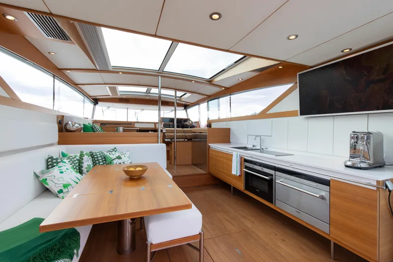  Yacht Photos Pics Luxurious interior of 2011 Delta Powerboats 54 Carbon IPS with modern kitchen and seating area.