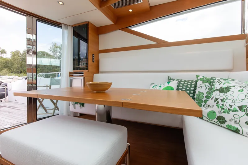  Yacht Photos Pics Luxurious interior of 2011 Delta Powerboats 54 Carbon IPS with modern decor and green accents.