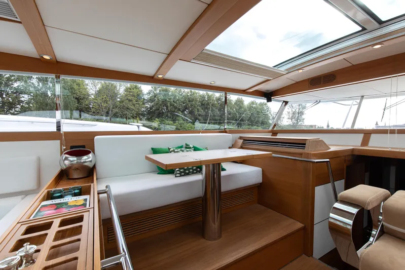  Yacht Photos Pics Luxurious interior of 2011 Delta Powerboats 54 Carbon IPS with modern seating and wooden accents.