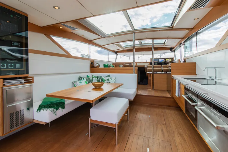  Yacht Photos Pics Luxurious interior of 2011 Delta Powerboats 54 Carbon IPS with modern kitchen and seating area.