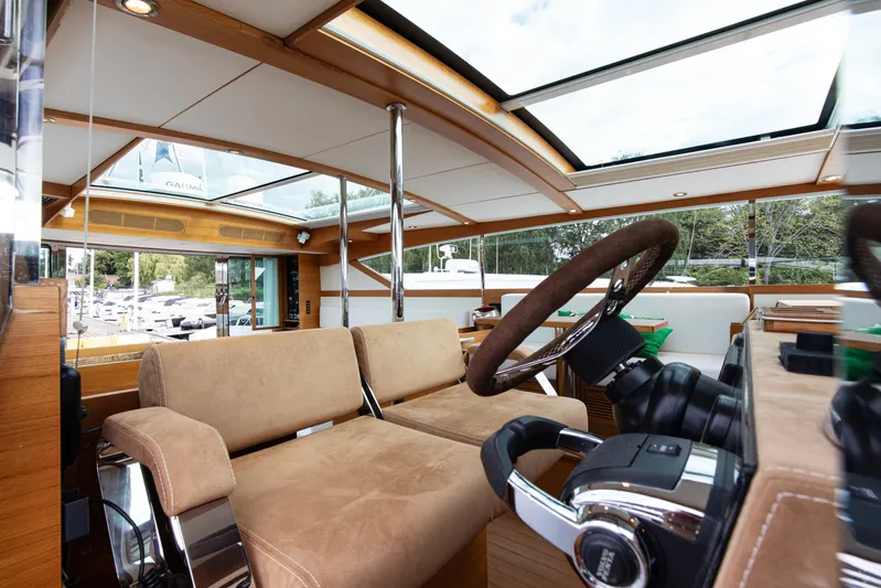  Yacht Photos Pics Luxurious interior of 2011 Delta Powerboats 54 Carbon IPS with plush seating and modern controls.