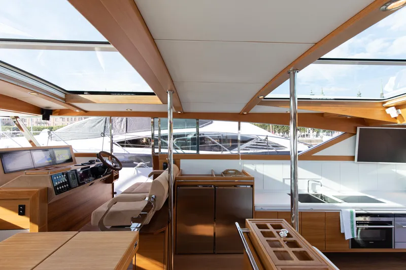  Yacht Photos Pics Interior of 2011 Delta Powerboats 54 Carbon IPS, featuring modern helm and kitchen area.