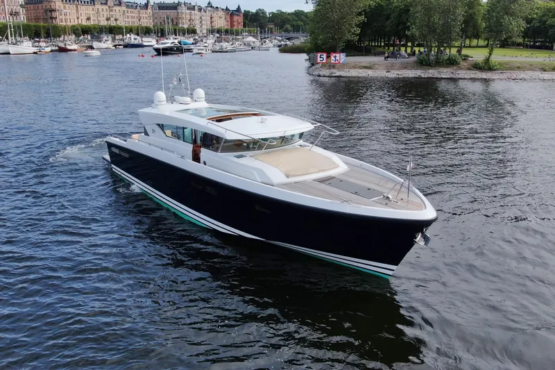  Yacht Photos Pics 2011 Delta Powerboats 54 Carbon IPS cruising on a scenic waterway.