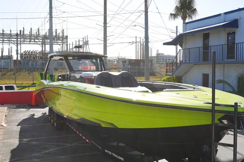  Yacht Photos Pics 2022 MTI 50V Center Console boat in bright green on a trailer.