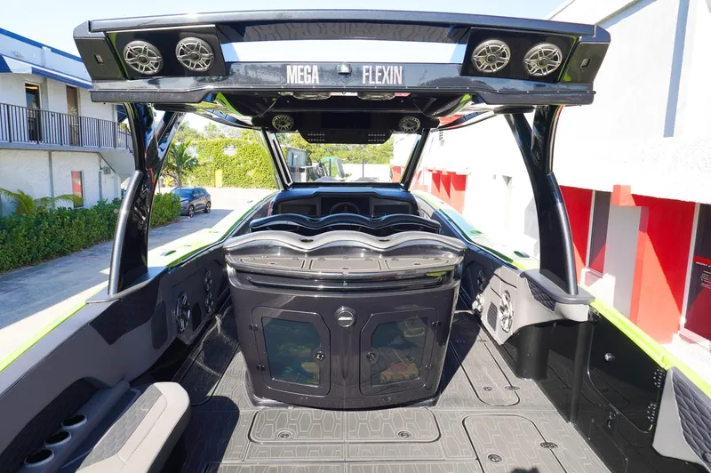  Yacht Photos Pics 2022 MTI 50V Center Console boat interior with advanced audio system and sleek design.